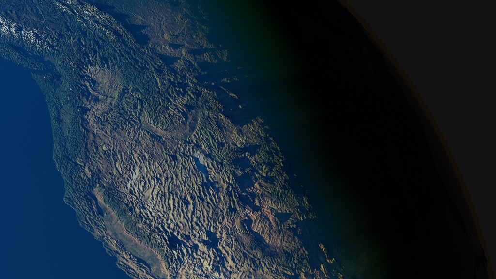 Mountainous coastline viewed from orbit at terminator