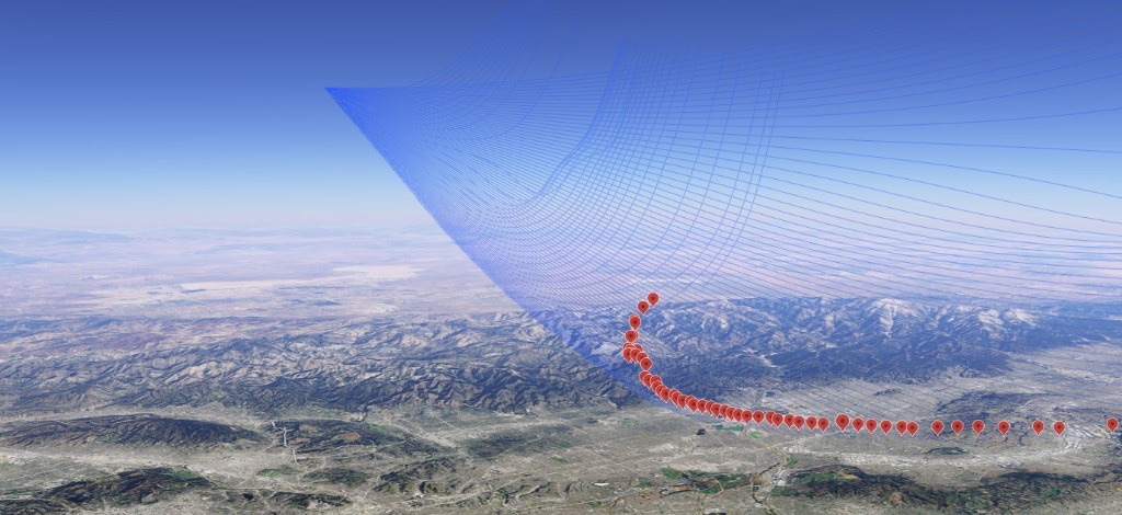 Geospatial visualization with red markers and blue trajectory fan